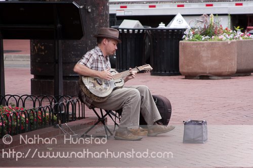 A guitar player on the Pearl Street Mall in Boulder, CO